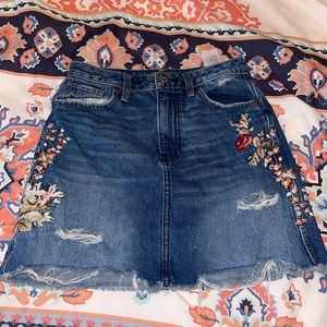 American Eagle jean skirt with floral embroidery.